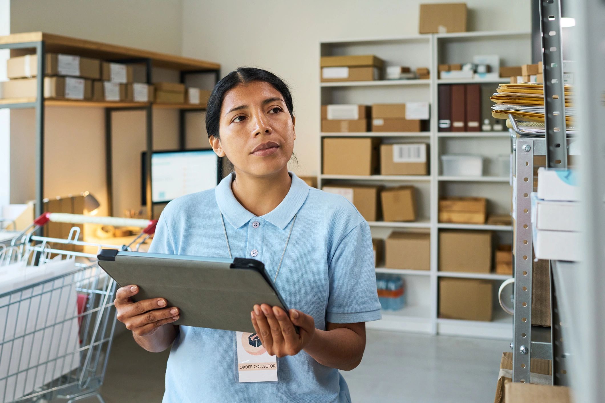 Professional reviewing operational details on a tablet